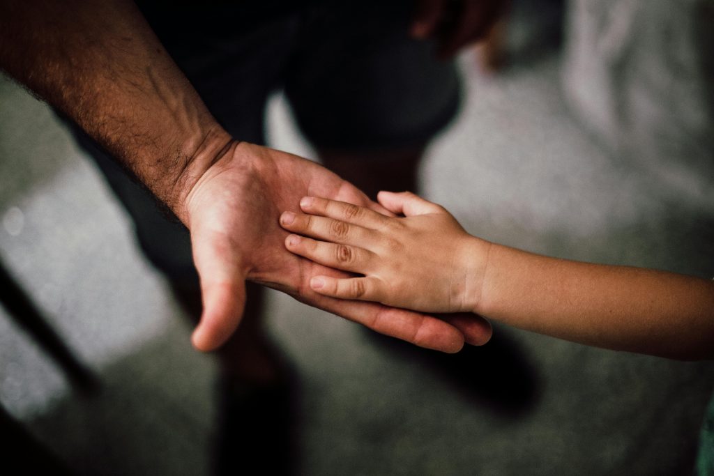 Father and Child's Hands Together